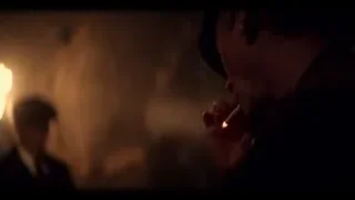 man smoking a cigarette in a dark room — Peaky Blinders