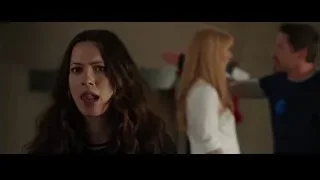 young woman looking away, two people conversing — Iron Man 3