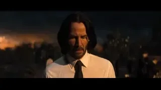 Man's face close-up with cityscape background — John Wick: Chapter 4