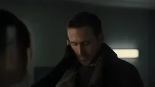 man with head in hands in dim light — Blade Runner 2049