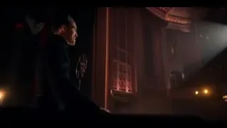 Man speaking into microphone in dim room — Peaky Blinders