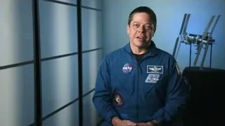 man in blue space suit gesturing — Elon Musk: Return to Space