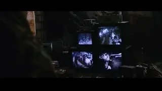 man looking at multiple screens in dark room — Iron Man