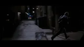 police car in narrow dark alleyway — Batman: The Dark Knight Rises