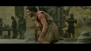 Man in brown tunic with sword in stone cave — Gladiator 2