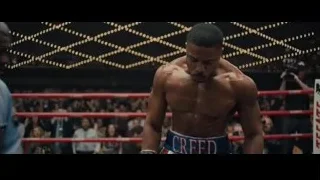 man in boxing ring with RISE jacket — Creed 2
