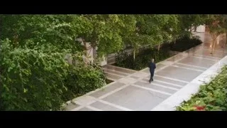 man in suit walking in garden — Jobs