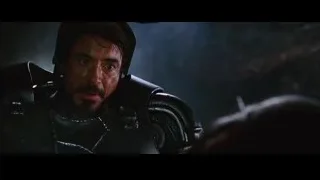 man in armor in battle-ready stance — Iron Man