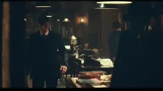 two men talking in dimly lit vintage room — Peaky Blinders
