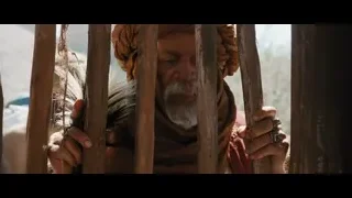elderly man with turban peeking through bars — Gladiator