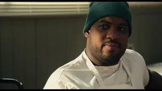 man in chef's apron and beanie — The Bear