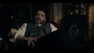 man with beard sitting in dimly lit room — Peaky Blinders