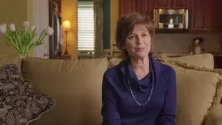 middle-aged woman sitting on couch — Screened Out