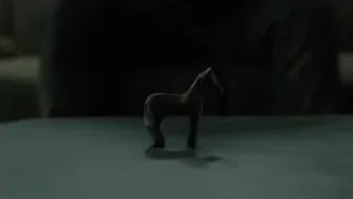 wooden horse figurine standing on surface — Blade Runner 2049
