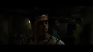 man in floral shirt in dimly lit room — Fight Club