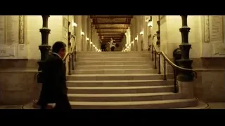 men in suits walking on marble staircase — Lucy