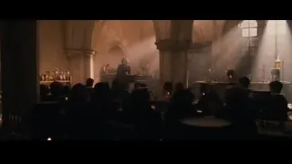 Man speaking at podium in hall — Harry Potter and the Philosophers Stone