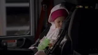 Young child in car seat looking at camera — Breaking Bad