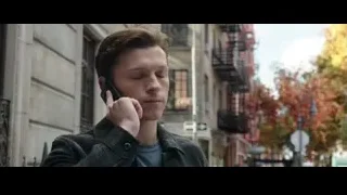 Young man talking on phone on city street — Spiderman: No Way Home