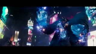 Person holding glowing blue crystal ball in cityscape — The Amazing Spider Man 2