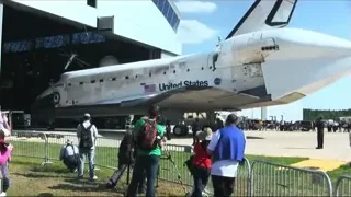 Space shuttle in front of hangar with people — Elon Musk: Return to Space