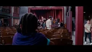 musicians playing on stage in old auditorium — The Karate Kid