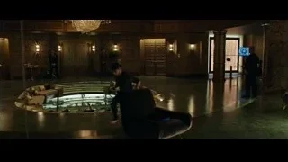 man kneeling with laptop in hotel lobby — Now You See Me 2