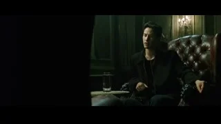 man sitting in brown leather armchair — The Matrix