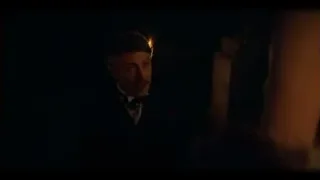 man holding cigarette in dark room — Peaky Blinders
