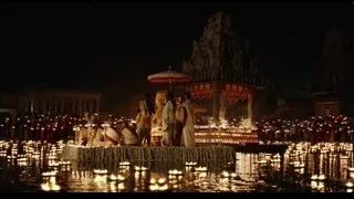 people gathered around illuminated temple at night — Life of Pi