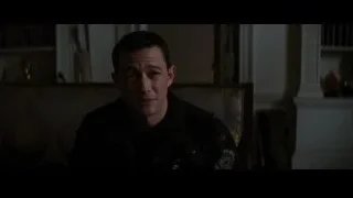 Man sitting in chair in dimly lit room — Batman: The Dark Knight Rises