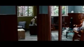 woman in living room with wooden walls — The Karate Kid