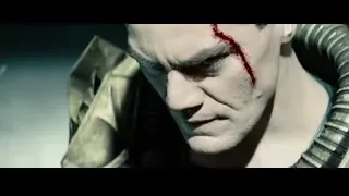 man with bloody face holding a sword — Superman: Man of Steel