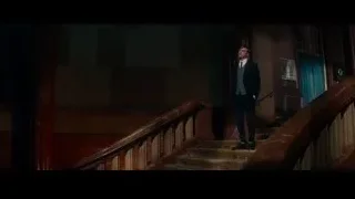 man speaking into microphone on dark staircase — The Amazing Spider Man 2