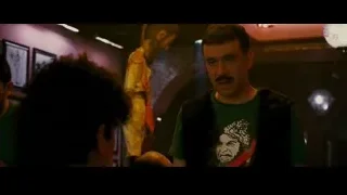 man with mustache in dimly lit room — The Dictator