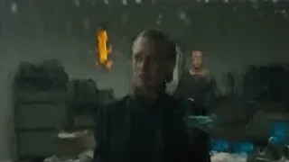 Man in dark room with burning fire — Blade Runner 2049