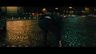 man with gun exiting black van at night — John Wick: Chapter 4