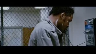 man in jail cell using payphone — The Persuit of Happyness