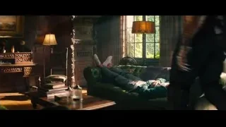 Man in mask on green leather couch — Deadpool 2