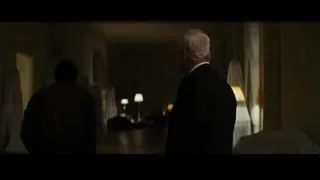 man holding metal object in dark eerie environment — Batman: The Dark Knight Rises
