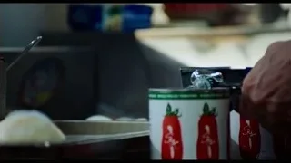 Hand opening a can in kitchen — The Bear