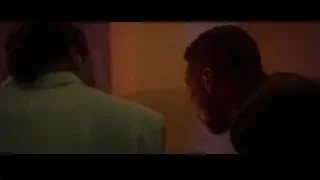 two men talking in dimly lit room — Creed 3