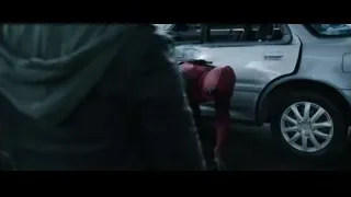 Deadpool standing in front of car — Deadpool