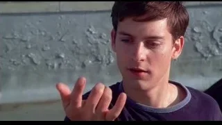 Young man pointing finger at concrete wall — Spider Man