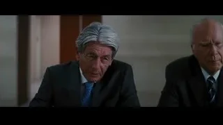 Two older men sitting at table — Batman: The Dark Knight Rises