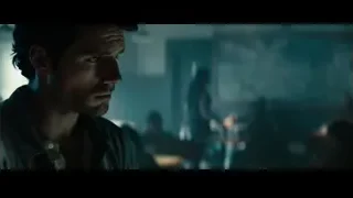 Man with serious expression in dim restaurant — Superman: Man of Steel
