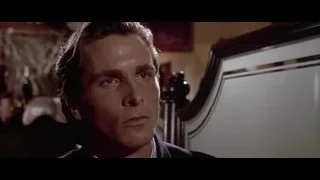 man in suit sitting at bar — American Psycho