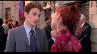 woman adjusting man's tie formally — Spider Man