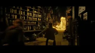 man standing near fire explosion — Harry Potter and the Deathly Hallows 2