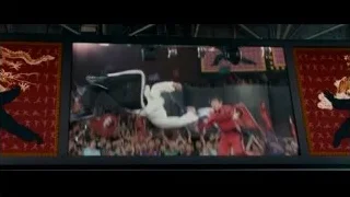 person in white holding sword on stage — The Karate Kid